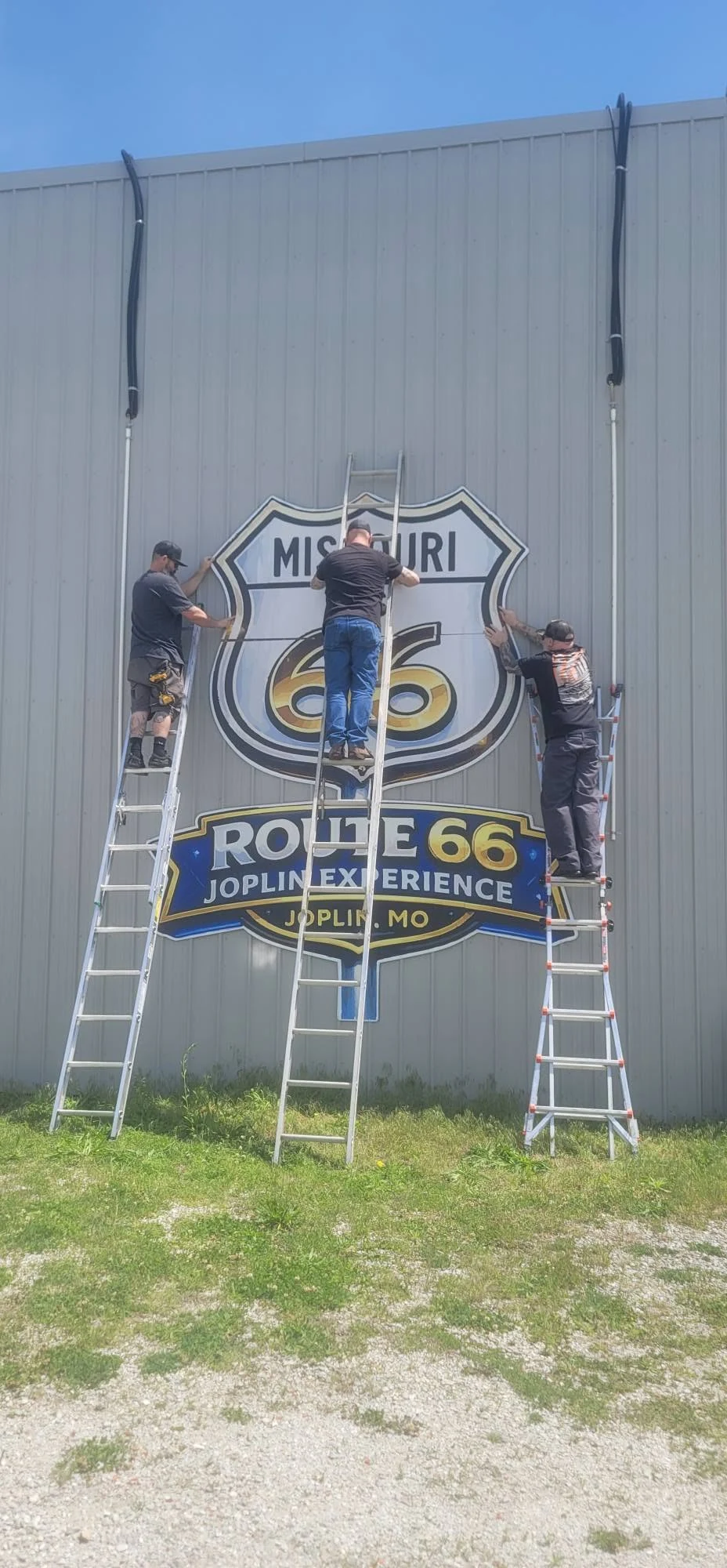 The Route 66 Joplin Experience sign being installed
